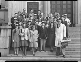 Architecture students wearing student caps gather in front of university main building in Hietalahti Helsinki