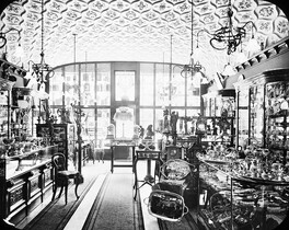Shop Interior: silver, gold goods - indicative of wealth/trade.