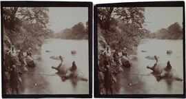People by the river Tana with a hippo shot by Jorma Gallen-Kallela (sitting on a rock), 1910.