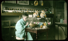Man painting shells.