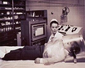 A Nurse Monitors a Young Patient