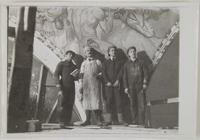 Jorma and Akseli Gallen-Kallela, Nils Wikberg and an assistant in front of The Giant Pike, one of the Kalevala cupola frescoes they were painting in the National Museum of Finland, 1928.