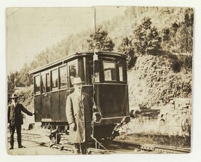2 Gentlemen posing with Parlour car - Inscribed on back 'this was a special Parlour car for a Big V.I.P.' (1947)