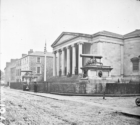 "Large public building, railings, steps, 6 columns in portico, 2 guns on plinths, one plinth inscribed India" is Tralee Courthouse