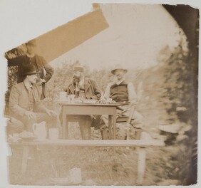 Axel GallÃ©n (on the left) sitting  with G. A. Serlachius and Louis Sparre in a garden in Keuruu, 1889.