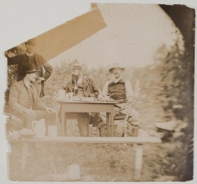 Axel GallÃ©n (on the left) sitting  with G. A. Serlachius and Louis Sparre in a garden in Keuruu, 1889.