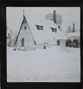 Winter-time view of TarvaspÃ¤Ã¤, photographed from the south-west. The picture features the building's roofs and its characteristic central tower and entrance archway