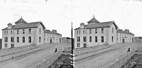 Modern building, possibly an hotel with "Butler" shop attached (is Lisdoonvarna)