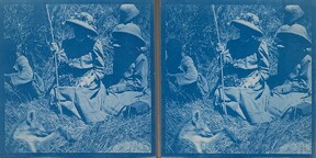 Gunbearer Muhammed bin Juma, Mary Gallen-Kallela and her children, Kirsti and Jorma, sitting in front of a dead hyena on Kahara Mountain, April 1910.