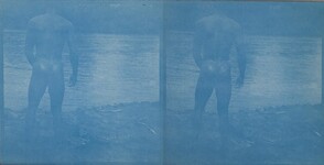 A naked man standing by a river in Africa, ca. 1909-1910.