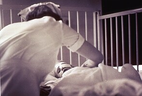 Nurse with small child with eye bandage