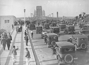 Motor cars driving across the Bridge, Sydney Harbour Bridge Celebrations, 19 March 1932, Hall & Co.