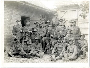 Group of British & Indian officers 1/4th Gurkhas in a French farm house [Le Sart]. Photographer: H. D. Girdwood.