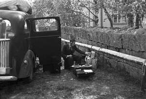 Technician recording a radio programme by a broadcast van for sound, 1939.
