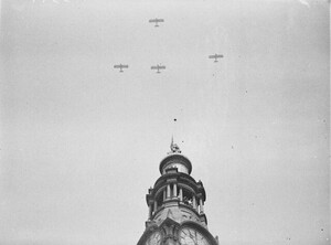 Five Westland Wapitis of No 3 Squadron, RAAF, fly past the GPO clock which shows "One-Minute's Silence", Armistice Day, 11am, 11 November 1934 / photographer Sam Hood