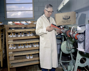 Inspecting shoes at Jaguar Shoes, Calgary, Alberta