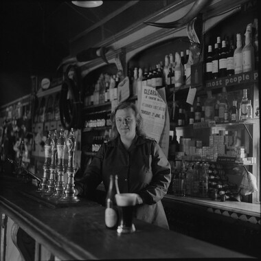 Miss Furey behind the bar, Moyvalley, Co. Kildare