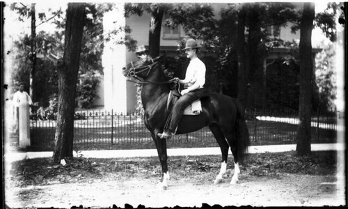 Man on horse in front of Richey home 1904